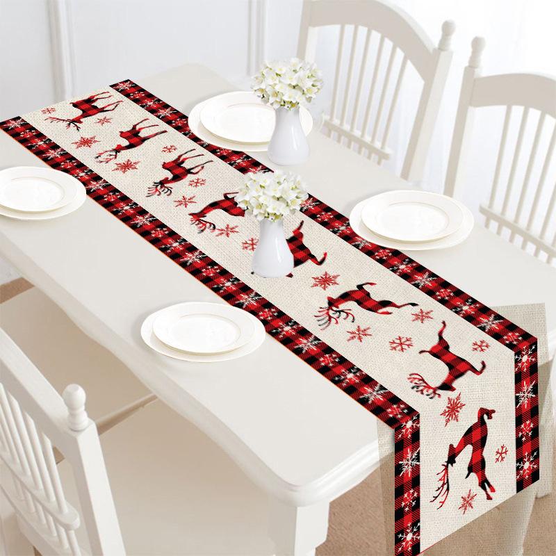 Christmas table runner, 30 x 180 cm, with a festive print on a laid table - beige with red reindeer