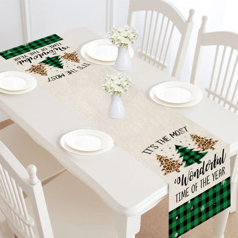Christmas table runner, 30 x 180 cm, with a festive print on a laid table - beige with green check and lettering