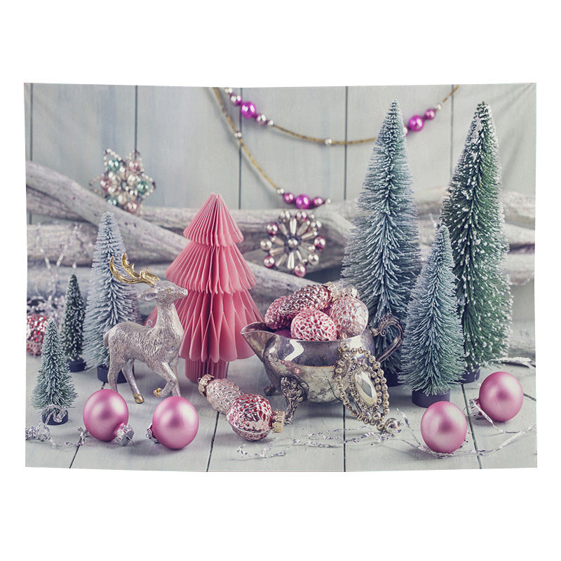 Christmas wall tapestry with a festive scene hanging on the wall - pink trees with garland
