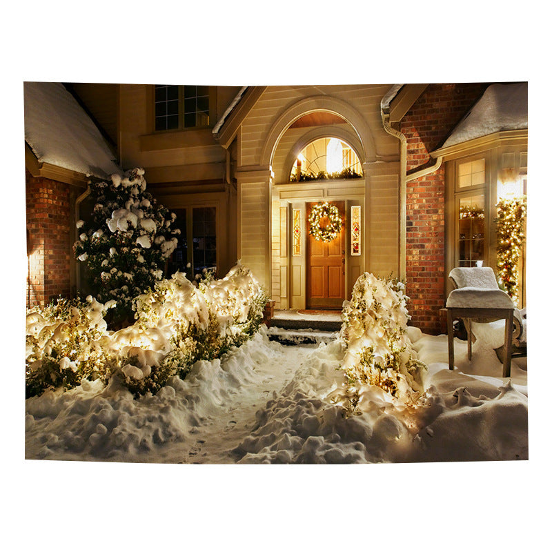Christmas wall tapestry with a festive scene hanging on the wall - snowy front door