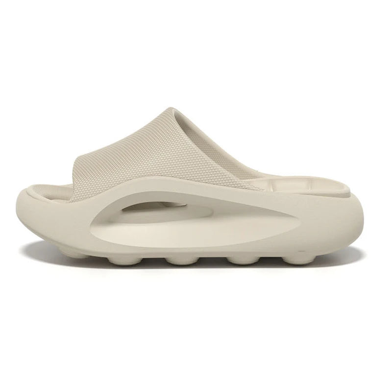 EVA sliders with a thick sole, contoured footbed and wide band across the instep - beige