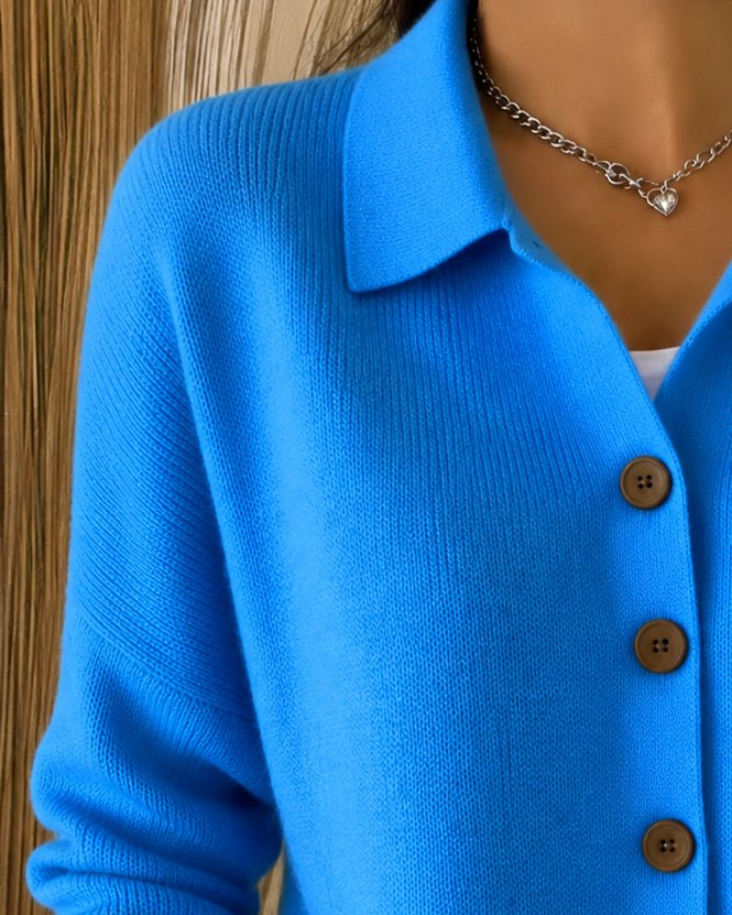 Women's knit cardigan with a pointed collar and contrast buttons