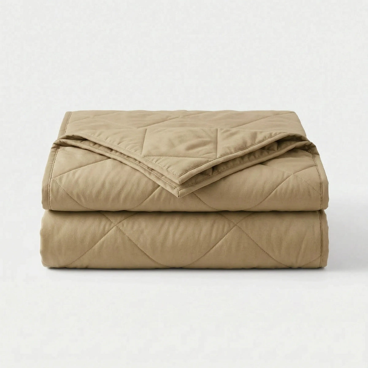 Light cooling blanket with diamond stitching over a made bed - khaki