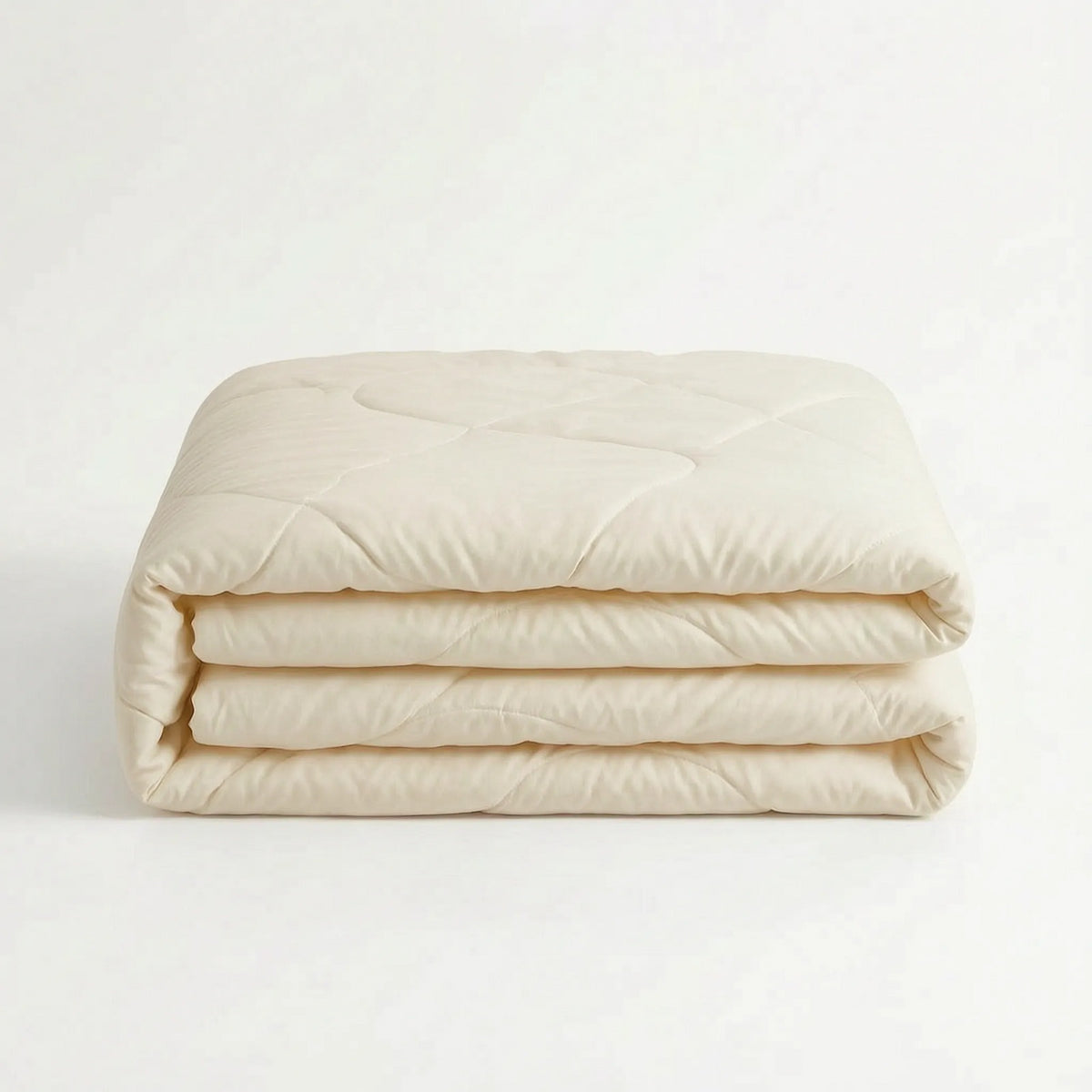 Light cooling duvet without a cover on a bed - off-white