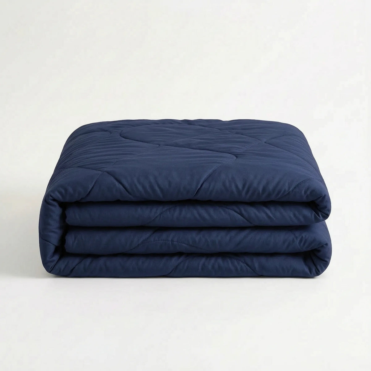 Light cooling duvet without a cover on a bed - navy