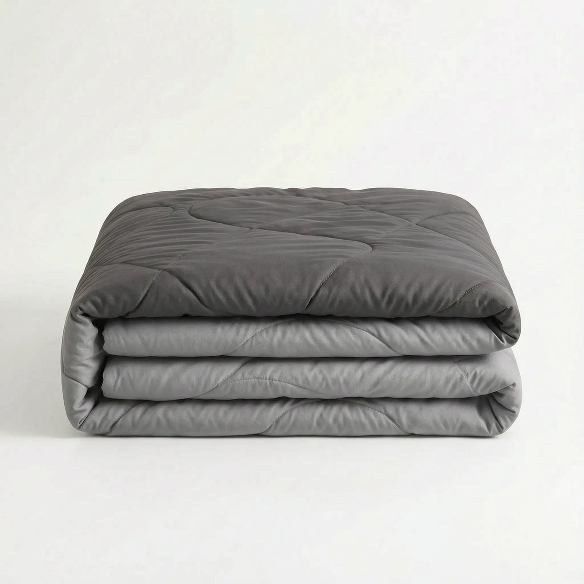 Light cooling duvet without a cover on a bed - dark grey/light grey