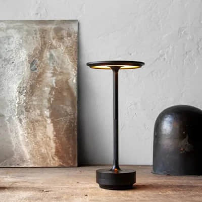 Cordless aluminium table lamp with a flat round shade, slim stem and round base