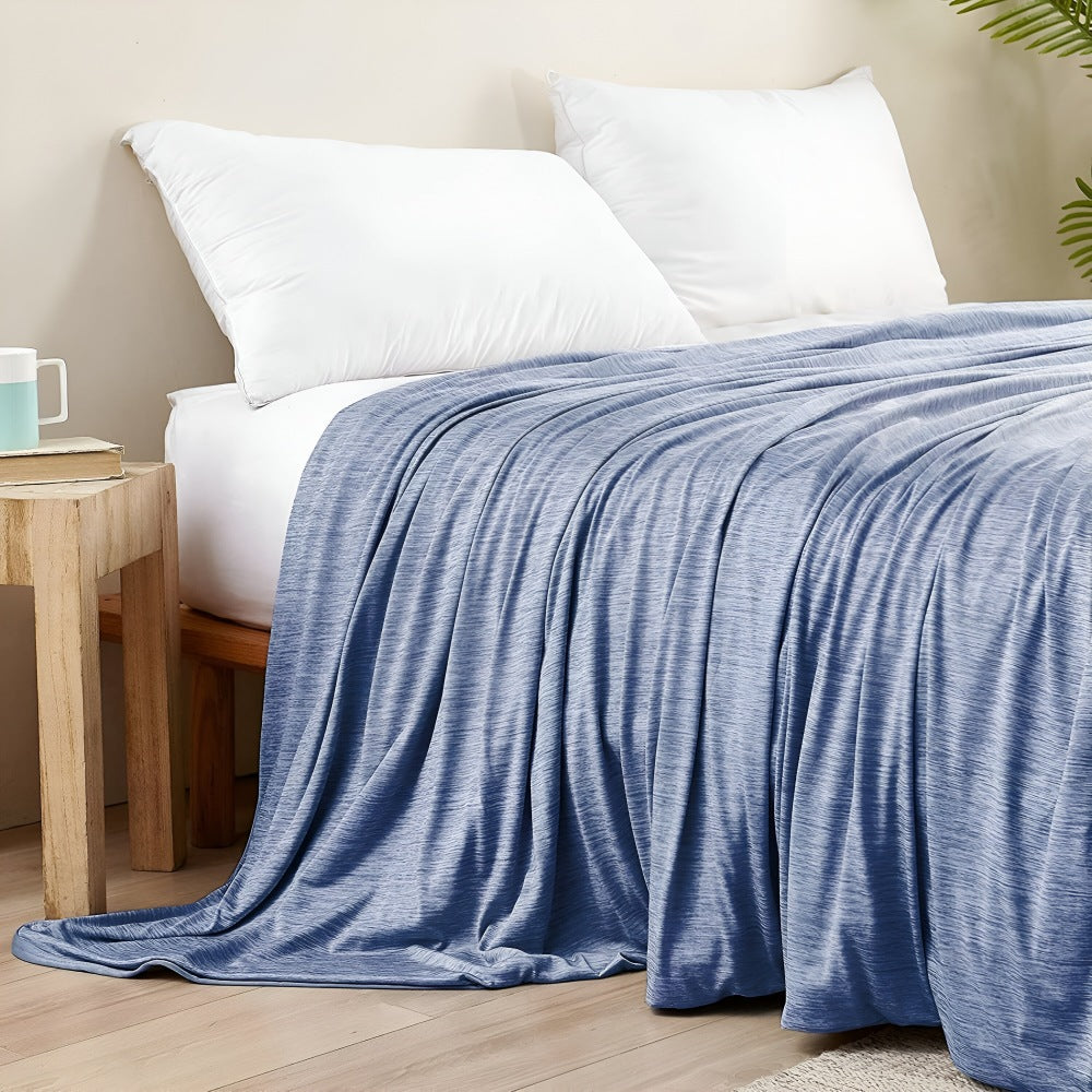 Cotton cooling blanket of 130 x 150 cm over a bed - view 2
