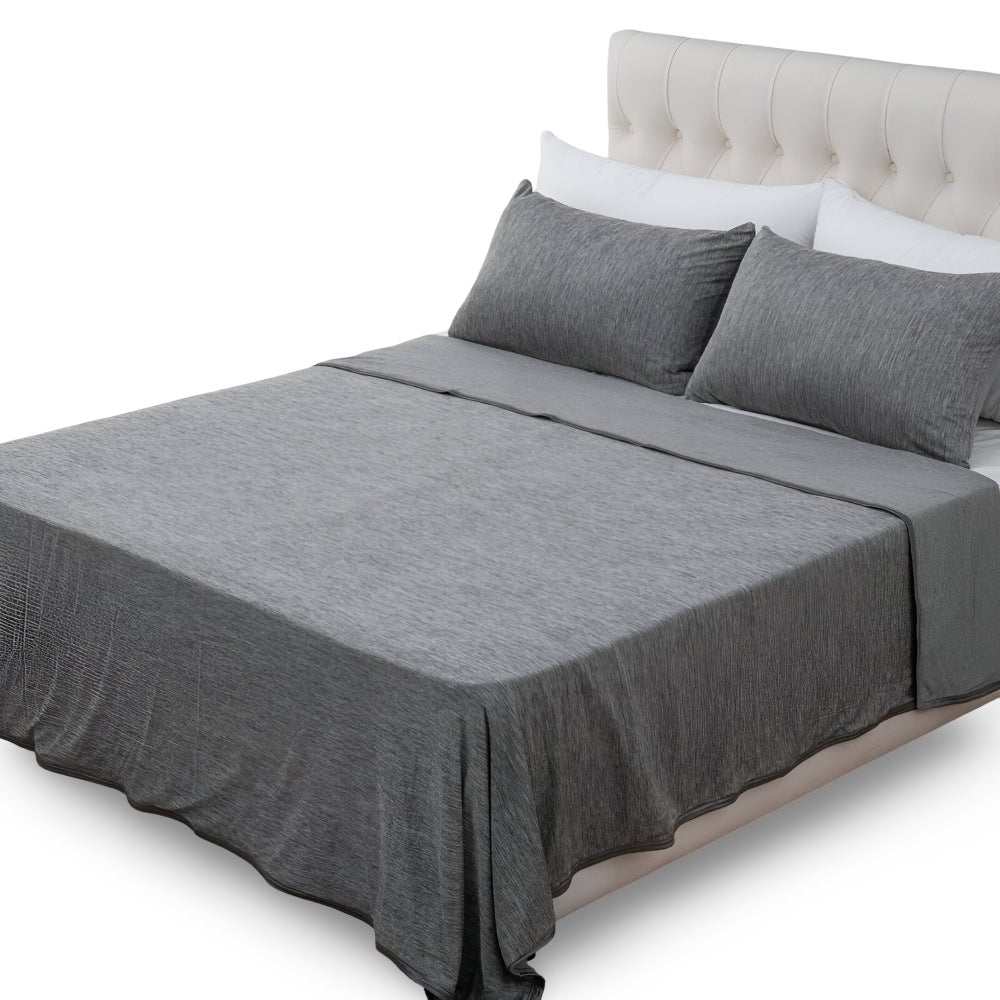 Cotton cooling blanket of 130 x 150 cm over a bed - heather grey