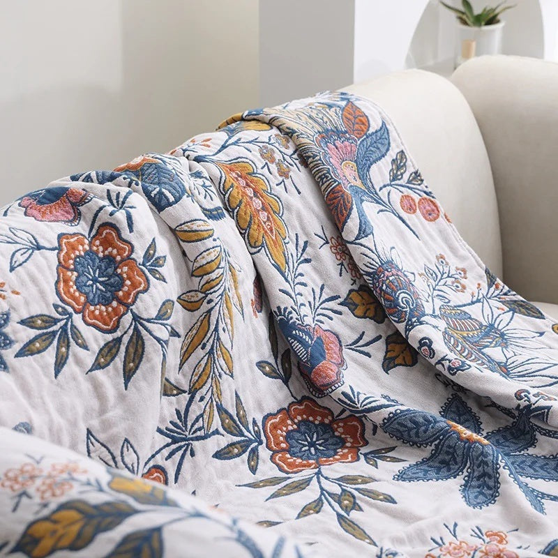 Cotton jacquard throw with a floral pattern and fringe over a sofa - view 4