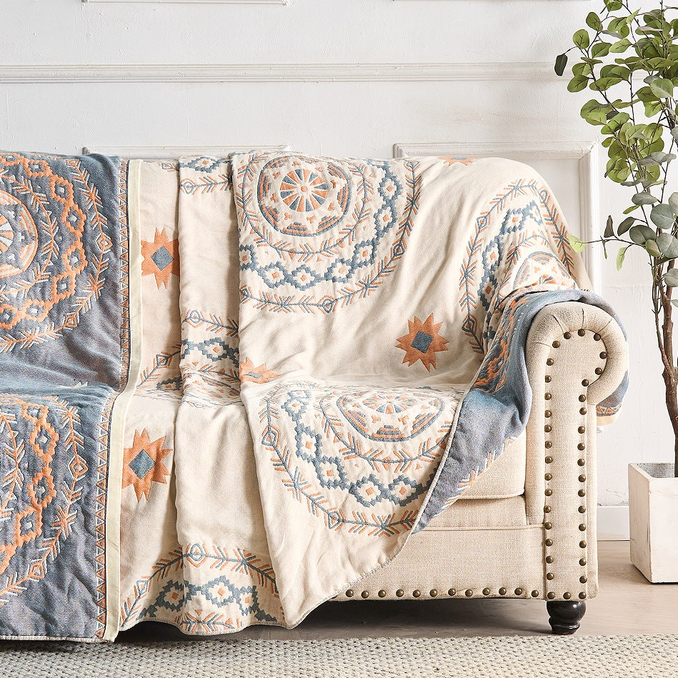 Cotton throw with a mandala print over a made bed - view 2