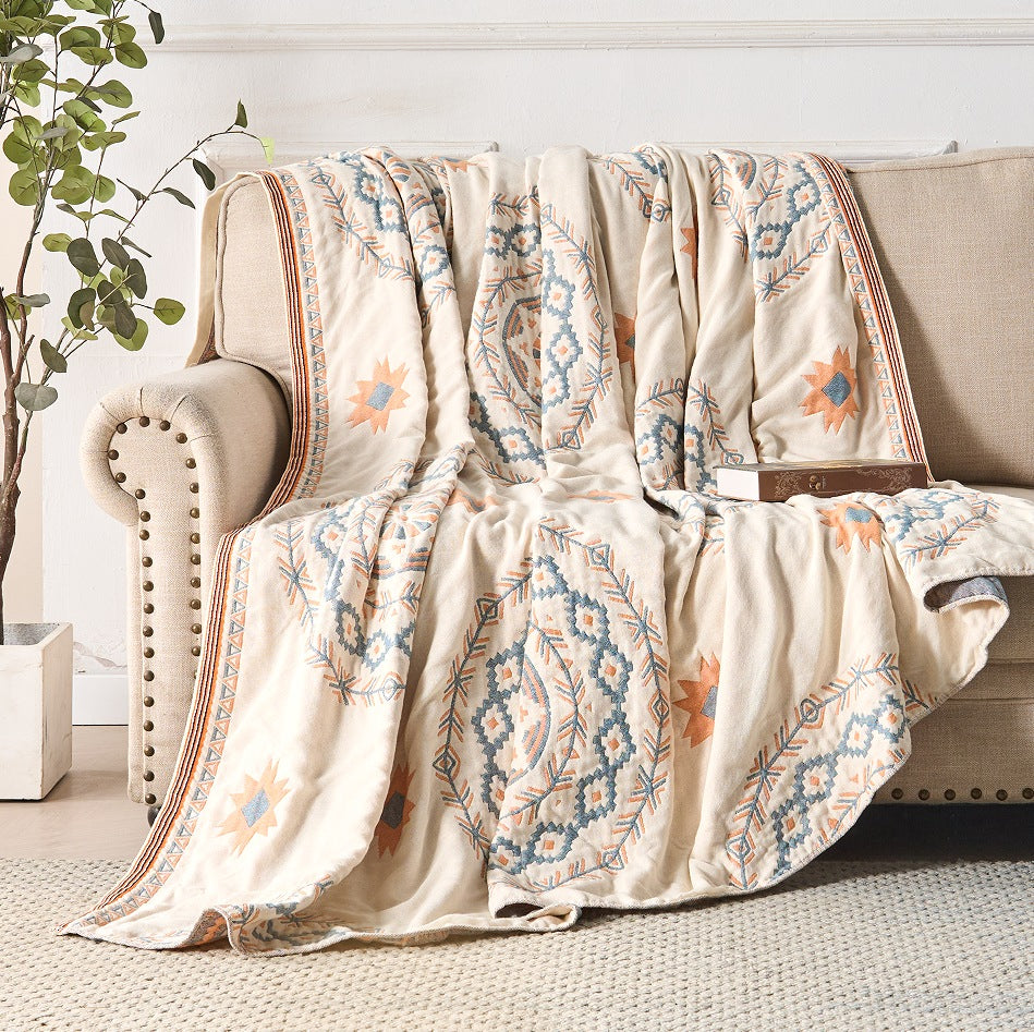 Cotton throw with a mandala print over a made bed - view 3