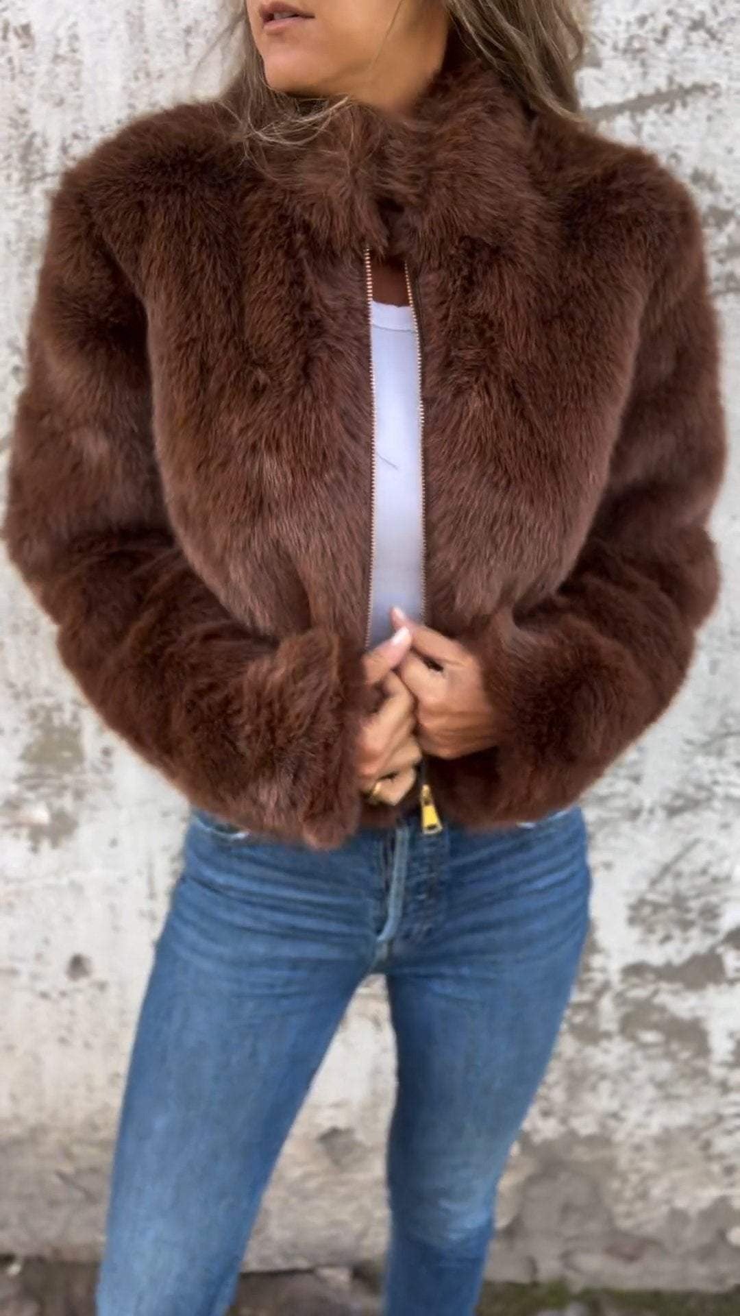 Women's cropped faux fur jacket with a stand collar and gold-tone zip