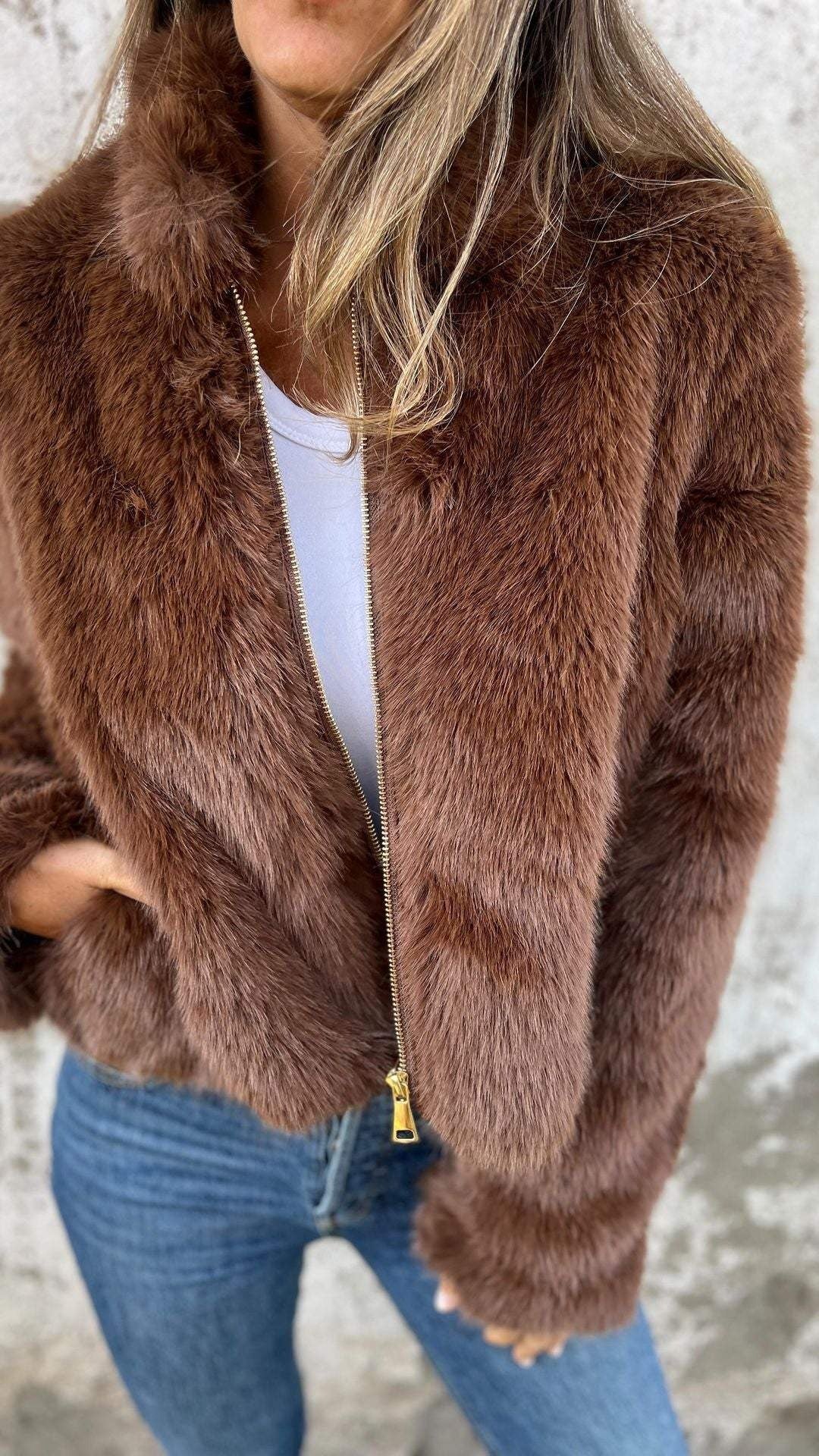 Women's cropped faux fur jacket with a stand collar and gold-tone zip