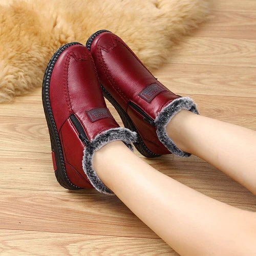 Leather-look ankle boots with a side zip and a thick faux fur lining