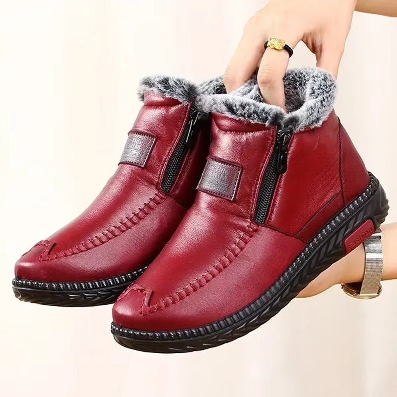 Leather-look ankle boots with a side zip and a thick faux fur lining