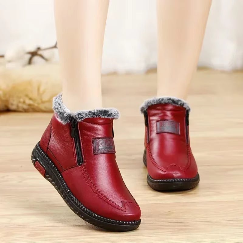 Leather-look ankle boots with a side zip and a thick faux fur lining