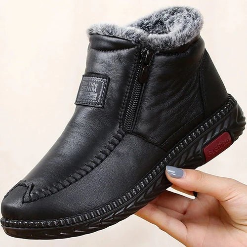 Leather-look ankle boots with a side zip and a thick faux fur lining