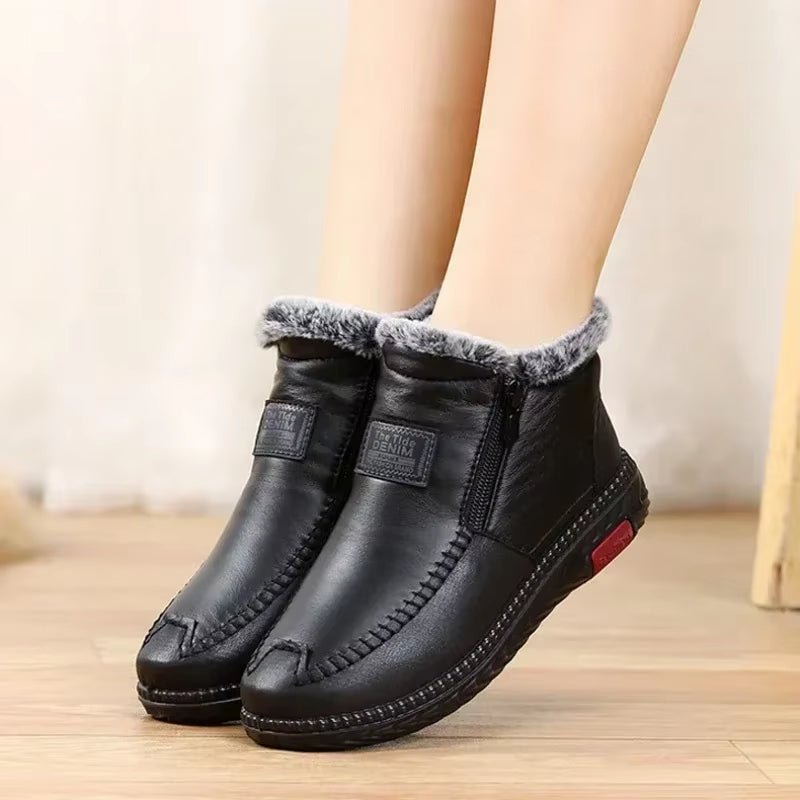 Leather-look ankle boots with a side zip and a thick faux fur lining