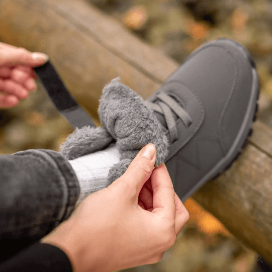 Unisex winter boots with a velcro strap over the lace and a fur lining
