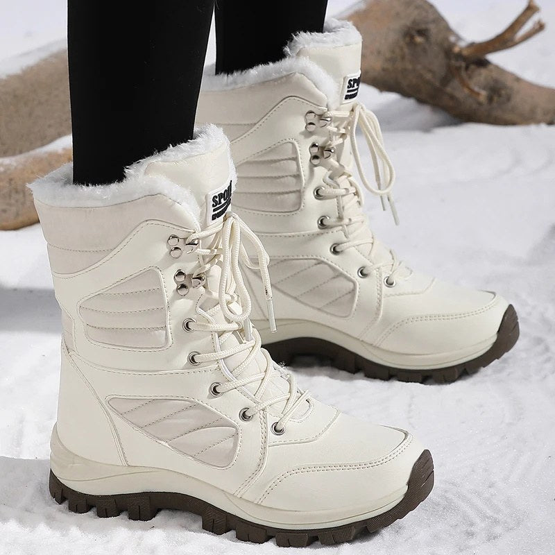 High snow boots with a faux fur cuff and a deep lug sole