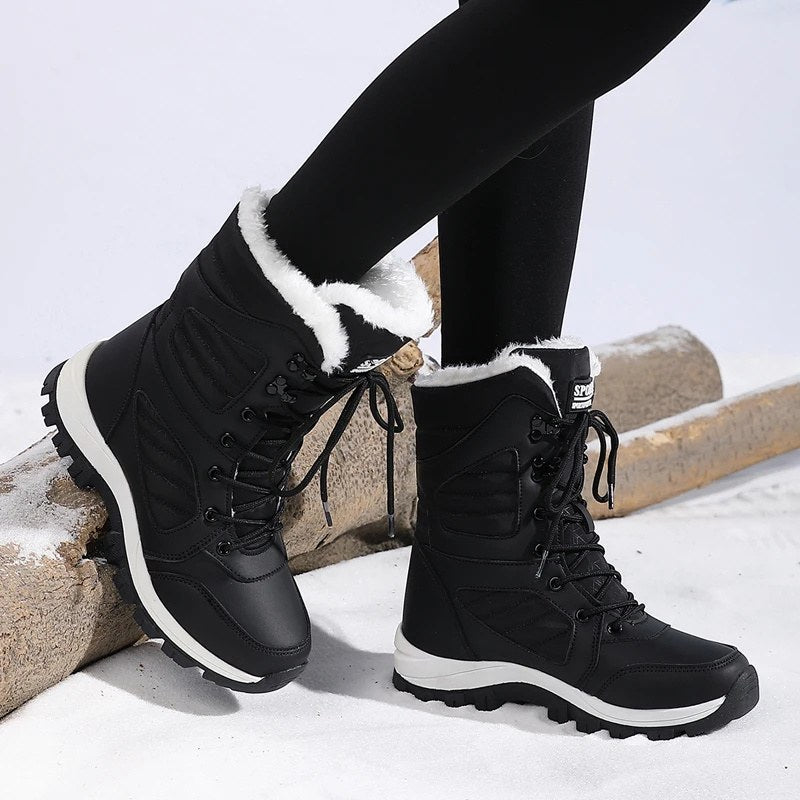 High snow boots with a faux fur cuff and a deep lug sole