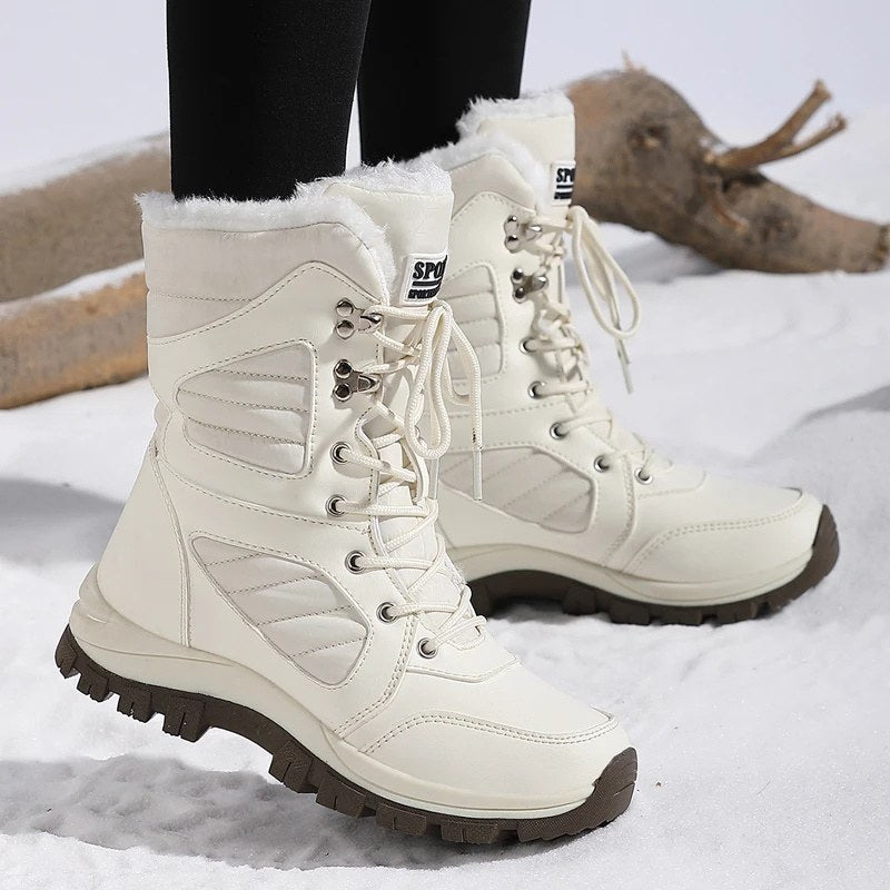 High snow boots with a faux fur cuff and a deep lug sole