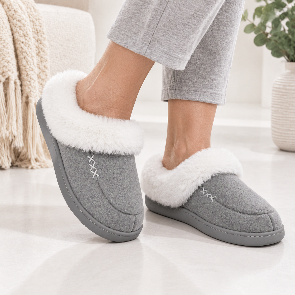 Women's slippers with a deep faux fur cuff and a cross-stitch detail