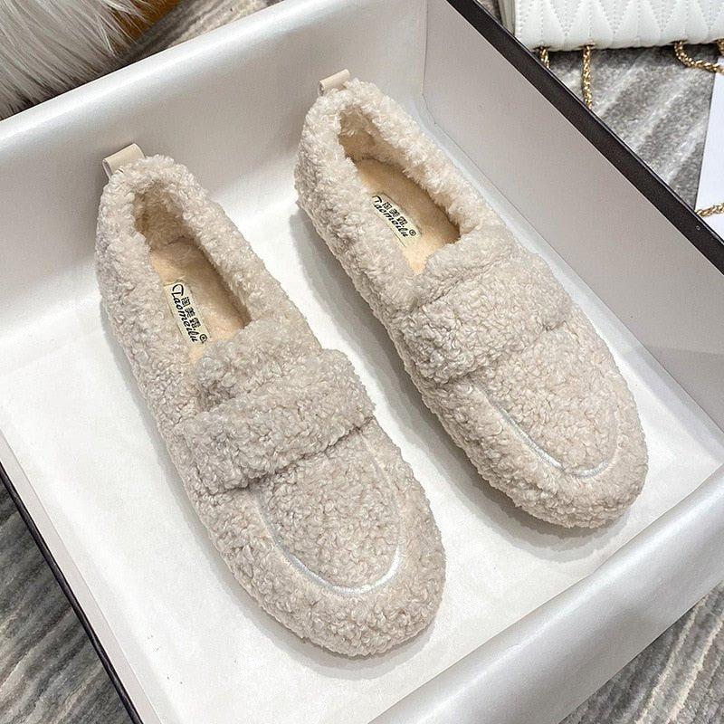Women's teddy fleece loafer slippers with a wide band and a lug sole