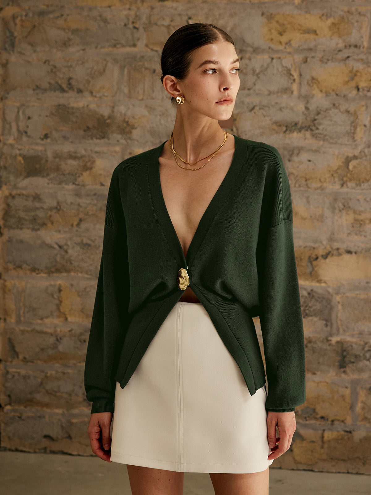 Women's deep V-neck cardigan with a single gold-tone button at the waist - dark green
