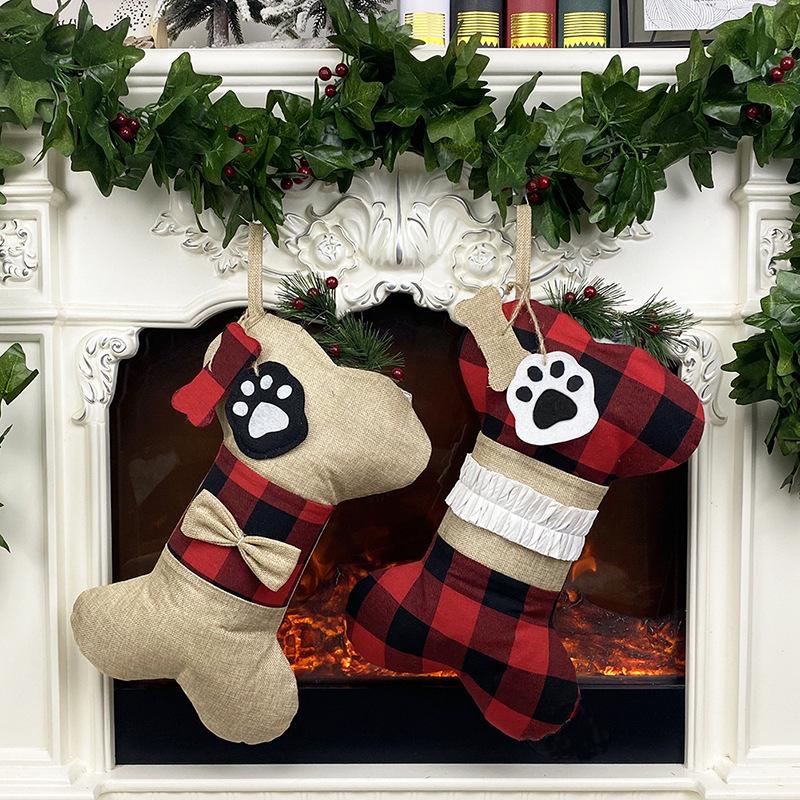 Bone-shaped Christmas stocking for a dog with a paw print tag and hanging loop