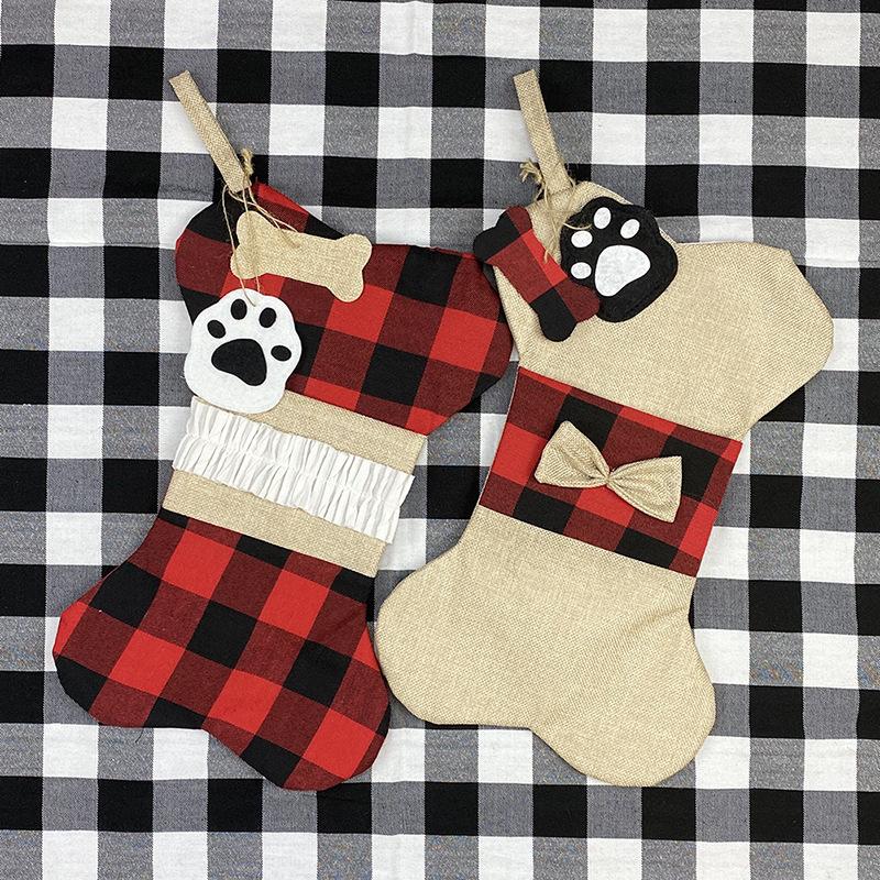Bone-shaped Christmas stocking for a dog with a paw print tag and hanging loop