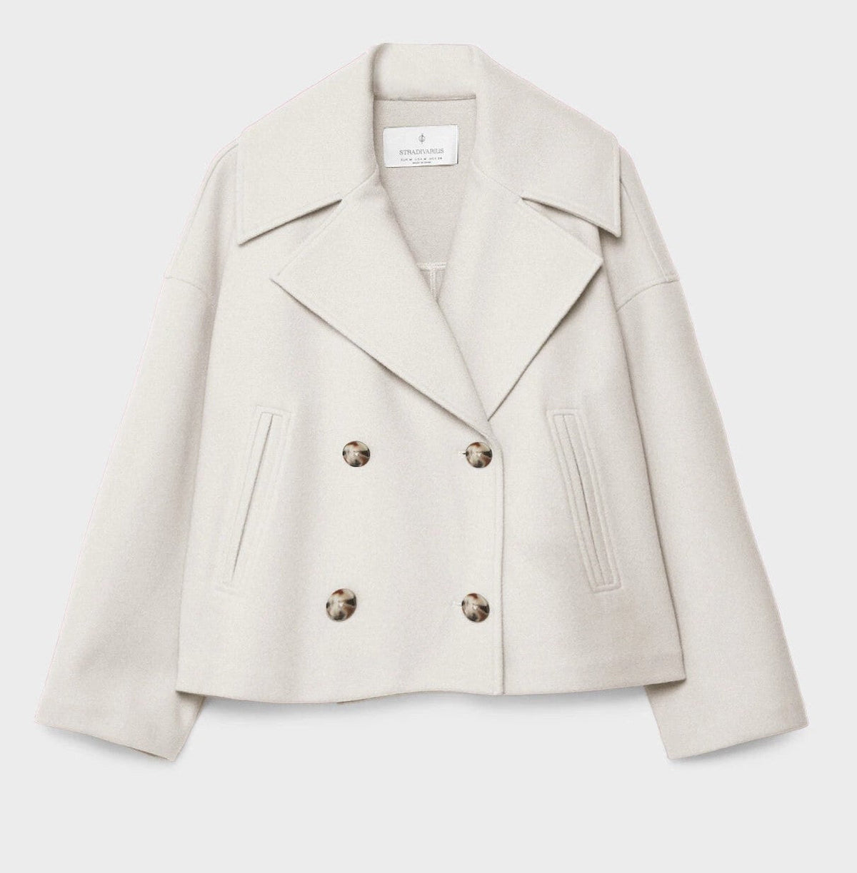 Short peacoat with a wide lapel and two rows of buttons