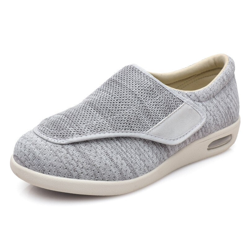 Ergonomic wide-fit shoes with an adjustable touch-fastening strap
