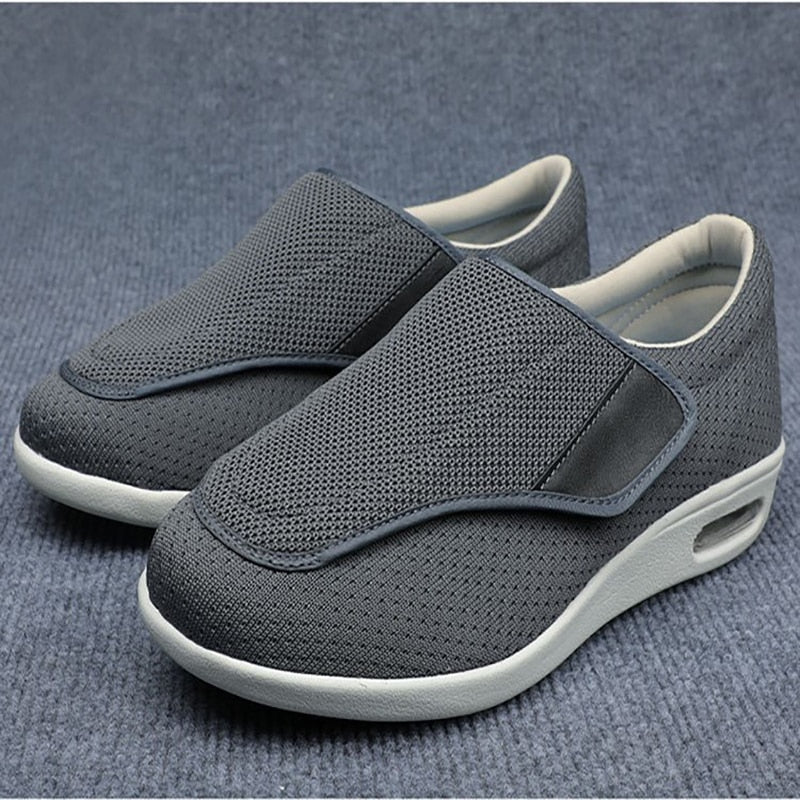 Ergonomic wide-fit shoes with an adjustable touch-fastening strap