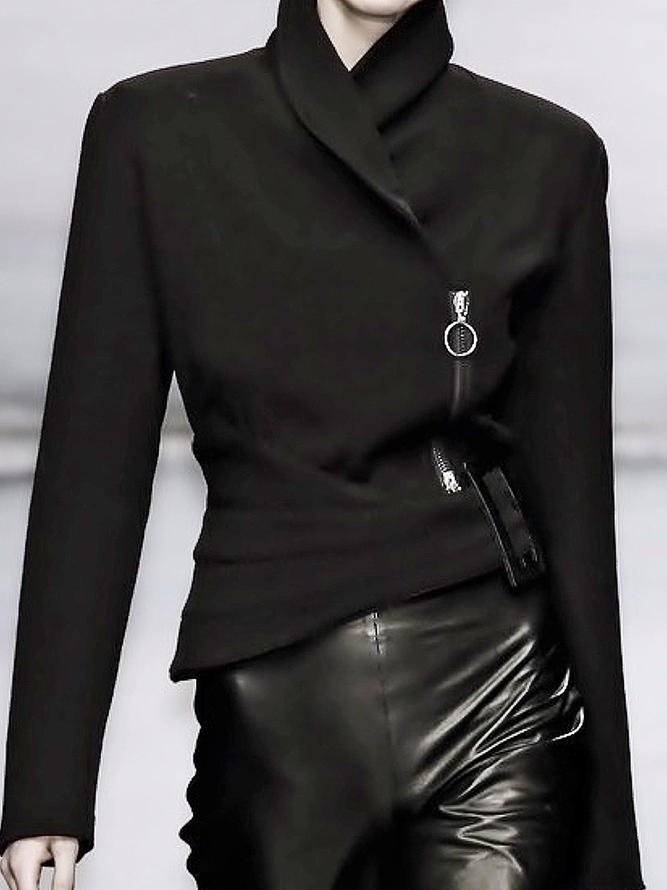 Black asymmetric jacket with a wrap front and a diagonal zip