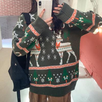 Women's knitted Christmas jumper with two Fair Isle reindeer, snowflakes and trees - green fair isle reindeer