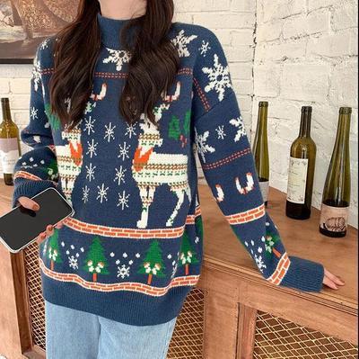 Women's knitted Christmas jumper with two Fair Isle reindeer, snowflakes and trees - navy fair isle reindeer