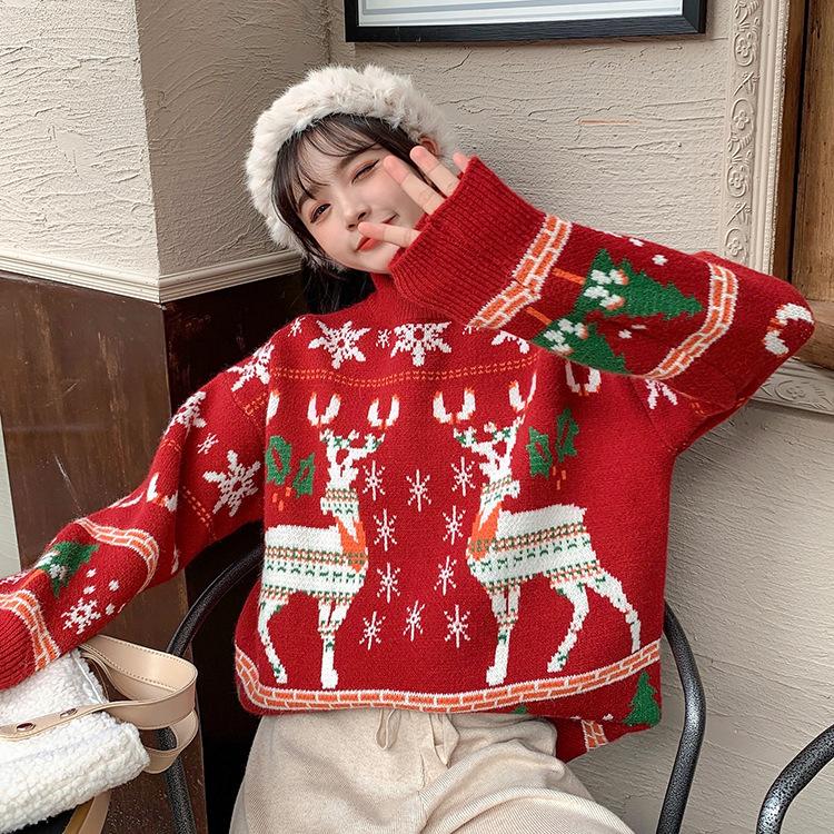 Women's knitted Christmas jumper with two Fair Isle reindeer, snowflakes and trees