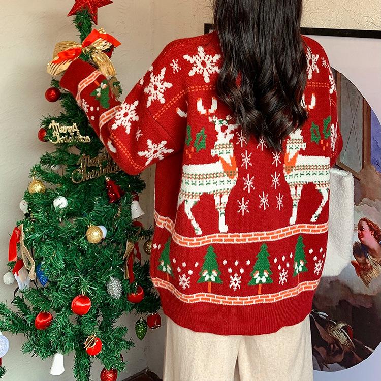 Women's knitted Christmas jumper with two Fair Isle reindeer, snowflakes and trees