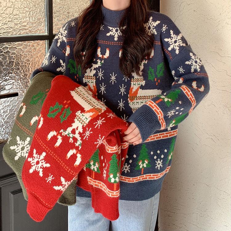 Women's knitted Christmas jumper with two Fair Isle reindeer, snowflakes and trees