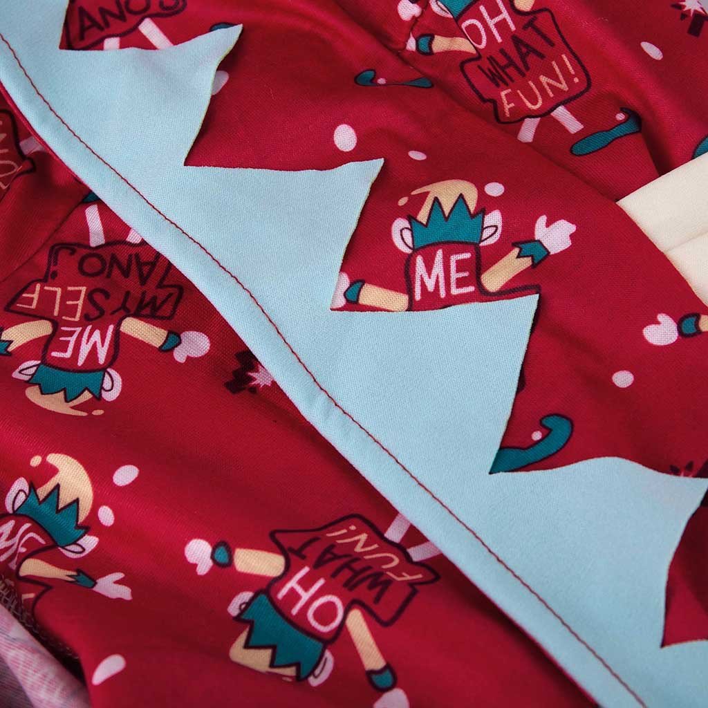 Red family Christmas onesie with an elf print and a hood with elf ears