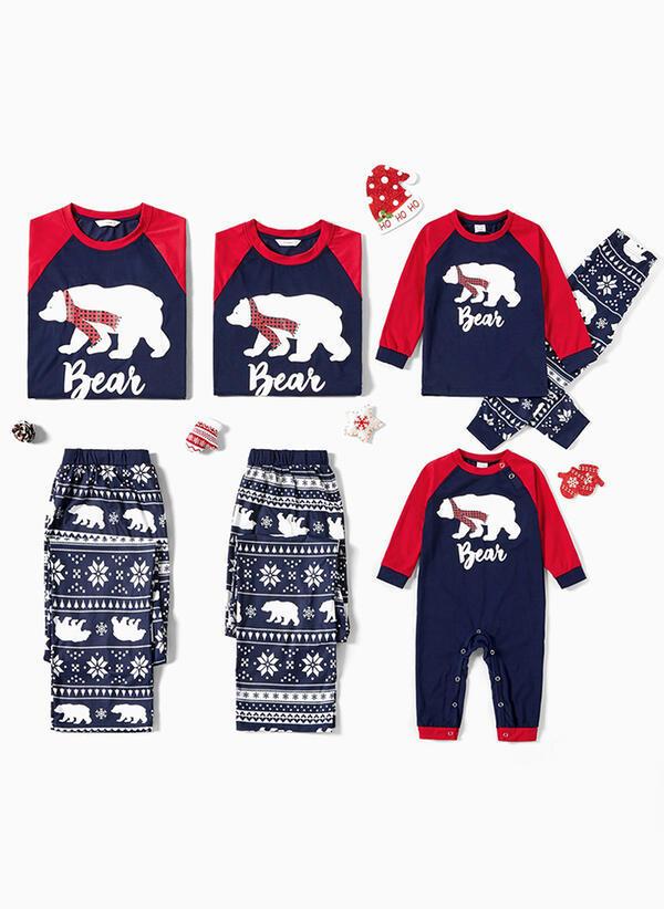 Matching family Christmas pyjamas with a polar bear print and snowflake bottoms