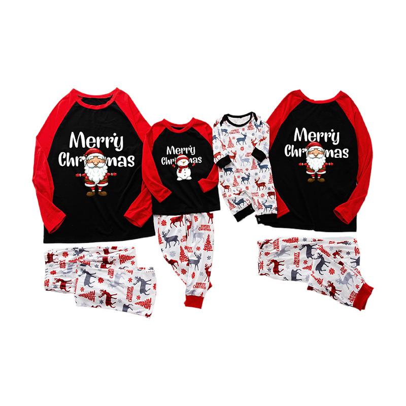 Matching family Christmas pyjamas with a Santa top and white reindeer bottoms