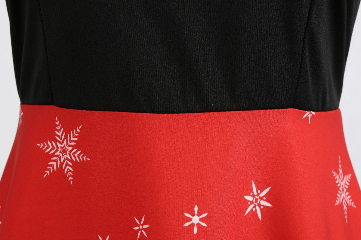 Women's Christmas swing dress with Father Christmas faces and a snowflake hem