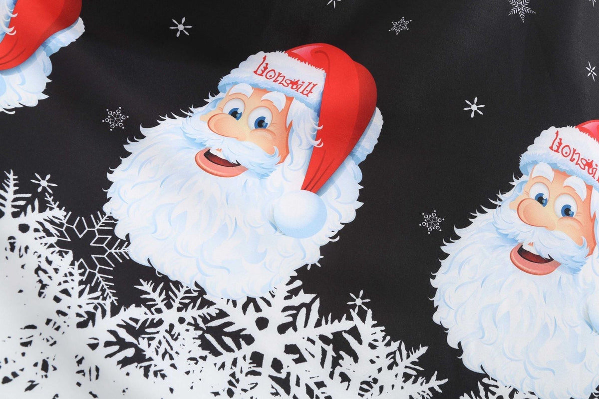 Women's Christmas swing dress with Father Christmas faces and a snowflake hem