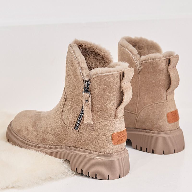 Women's suede-look ankle boots with a faux fur lining and side zip