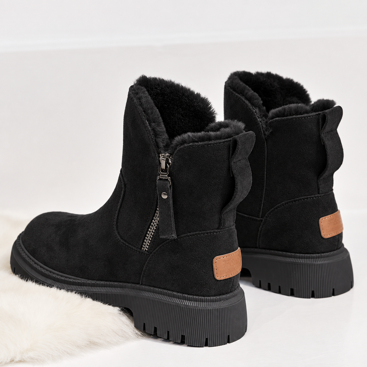 Women's suede-look ankle boots with a faux fur lining and side zip