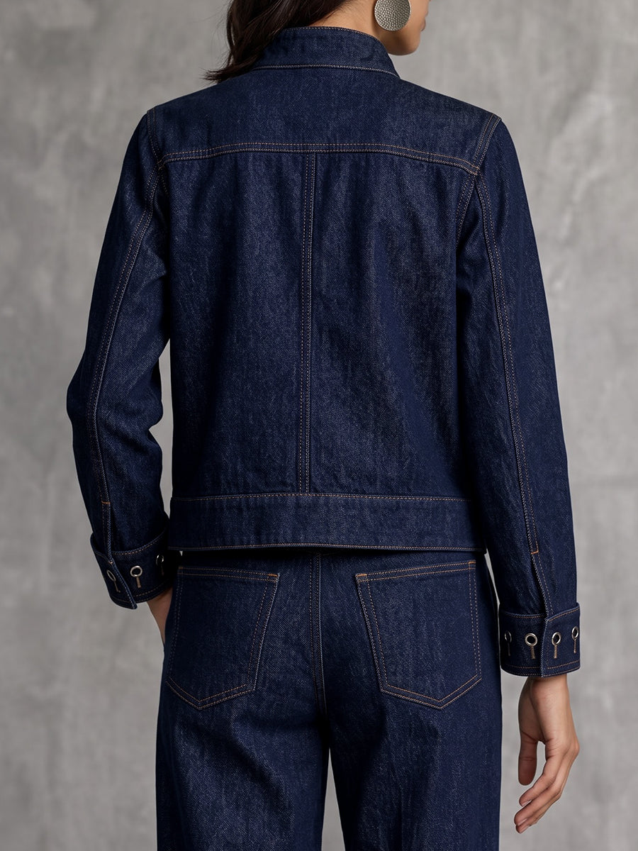 Cropped indigo denim jacket with a stand collar and eyelet trim