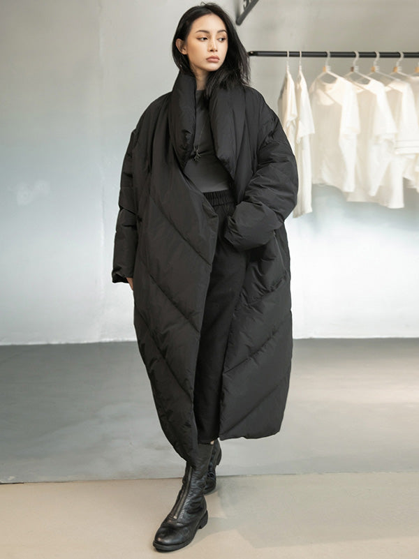 Long black padded coat with a scarf collar and diagonal quilting